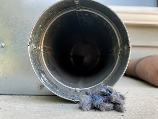 East San Gabriel Dryer Vent Cleaning technician using specialized equipment to clear severe dryer vent blockage in East San Gabriel